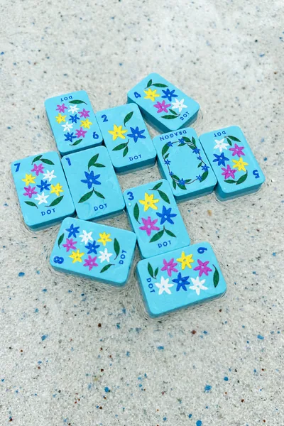 Floating Mahjong Tiles in bright blue for the Pool